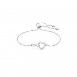 promo Swarovski Bracelet Infinity femme, cristaux blancs brillants forme cœur avec signe infini et chaîne plaquée rhodium